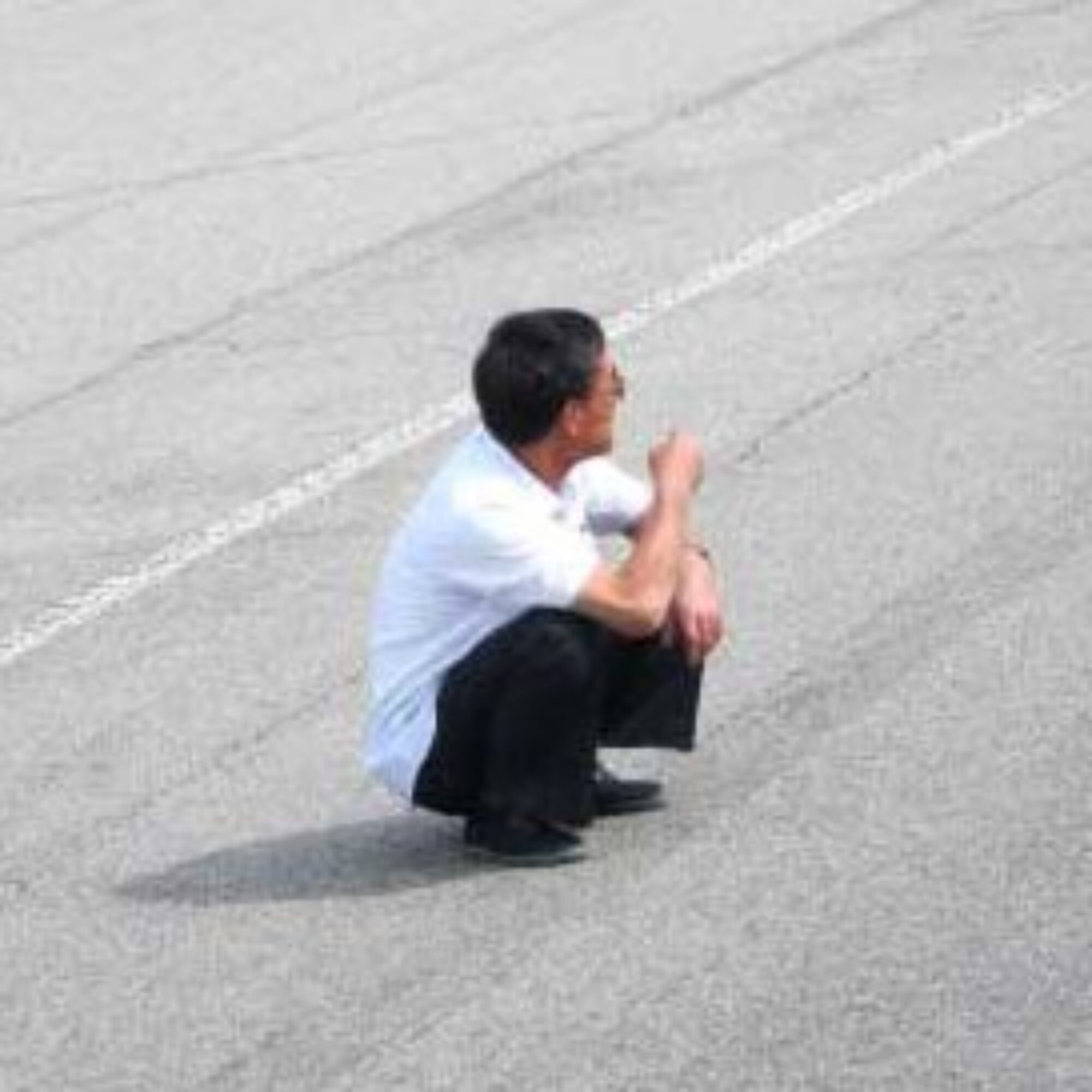 In North Korea, many people just sit by the roadside with nothing to do