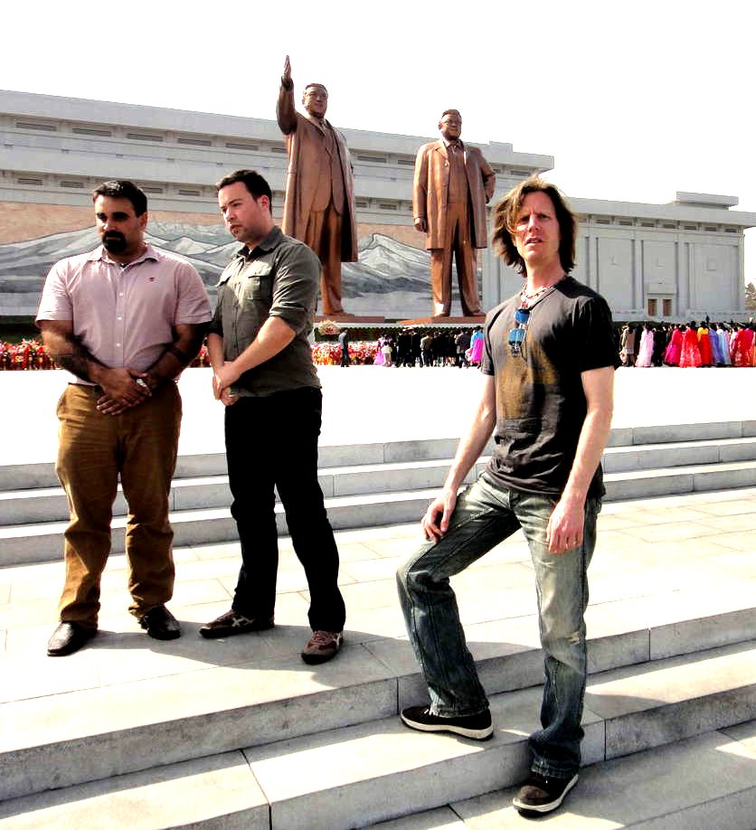 In front of colossal Kim statues In front of colossal Kim statues