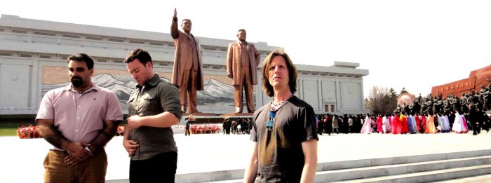 Joshua Spodek, Jordan, Joseph in front of Kim Il Sung and Kim Jong Il statues