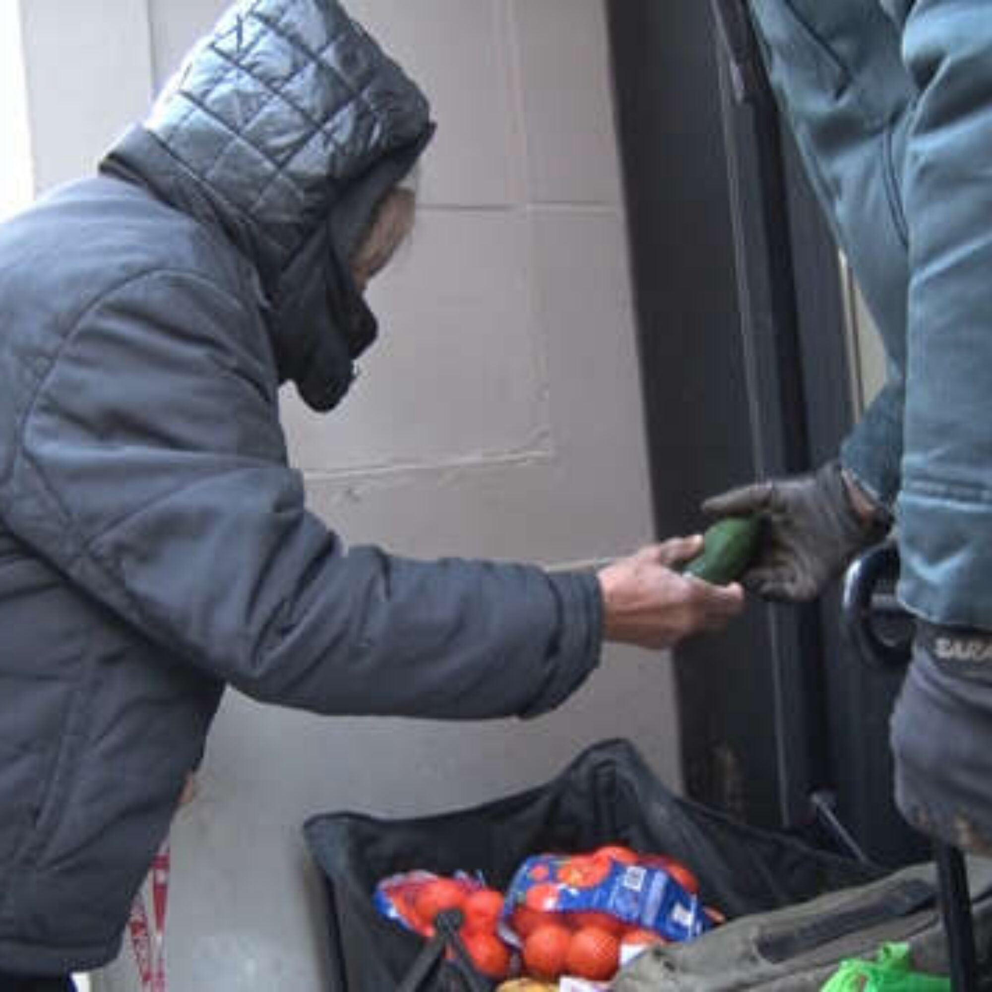 Tina Tombstone, a friend I volunteer delivering food with, on Fifth Avenue with vegetables